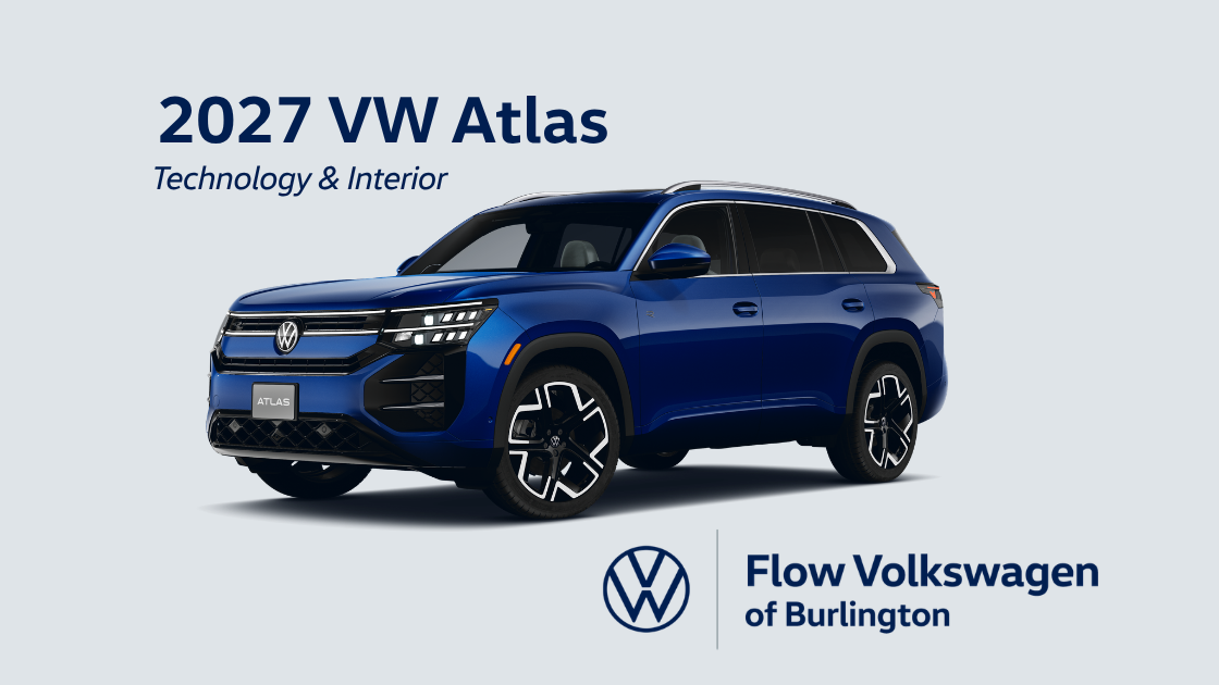 A blue 2027 VW Atlas in front of a gray background